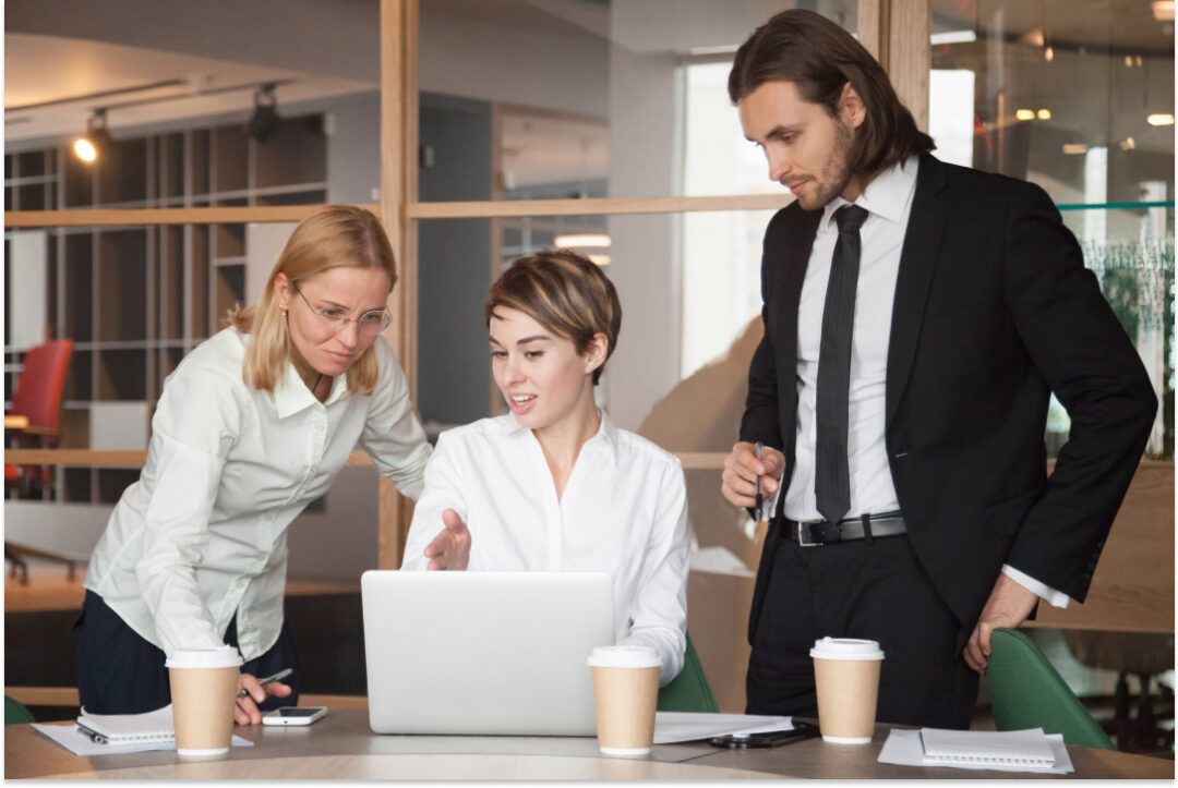 business-partners-negotiating-about-strategies-using-laptop