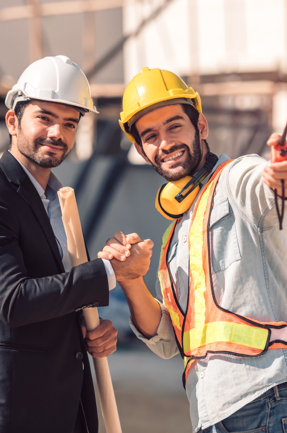 happy-workers-construction-site-young-civil-engineer-manager-architects-handshaking-construction-site-looking-construction-phase-cooperation-teamwork-concept 1