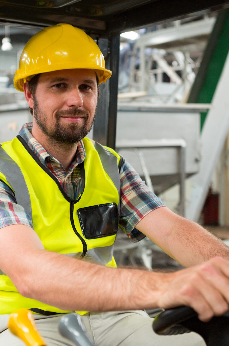 young-male-worker-driving-forklift-warehouse 1